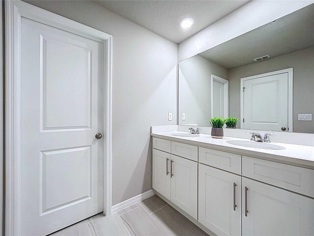 32451 Limitless Pl, Wesley Chapel, FL 33545 - full bath with double vanity and baseboards