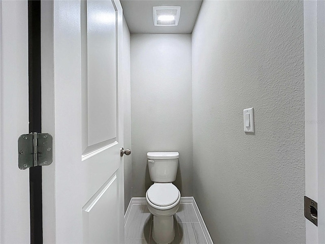 32451 Limitless Pl, Wesley Chapel, FL 33545 - bathroom featuring baseboards and toilet