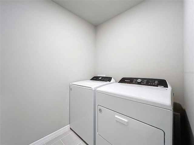 32451 Limitless Pl, Wesley Chapel, FL 33545 - laundry room with separate washer and dryer and baseboards
