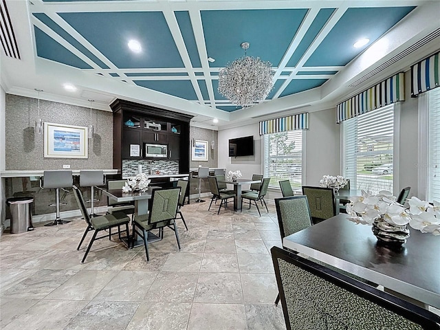 32451 Limitless Pl, Wesley Chapel, FL 33545 - dining space featuring stone tile floors, coffered ceiling, ornamental molding, baseboards, and recessed lighting
