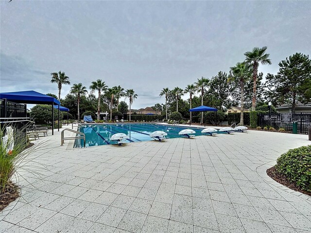 32451 Limitless Pl, Wesley Chapel, FL 33545 - community pool featuring a patio area