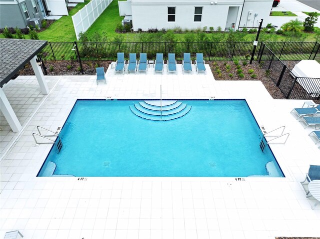 32451 Limitless Pl, Wesley Chapel, FL 33545 - community pool featuring a patio area
