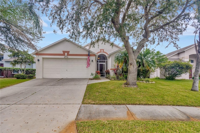 25101 Hyde Park Blvd, Land O Lakes, FL 34639 - view of front facade featuring a garage, stucco siding, concrete driveway, and a front yard