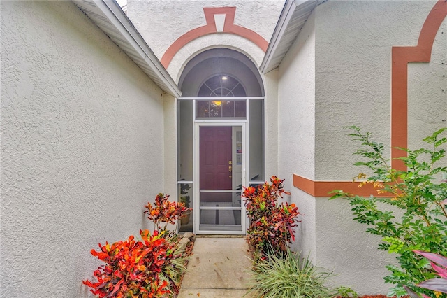 25101 Hyde Park Blvd, Land O Lakes, FL 34639 - doorway to property with stucco siding