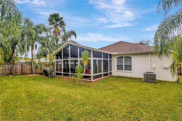 25101 Hyde Park Blvd, Land O Lakes, FL 34639 - rear view of property featuring stucco siding, a sunroom, and central AC unit