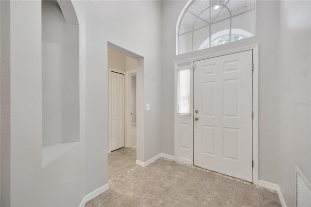 25101 Hyde Park Blvd, Land O Lakes, FL 34639 - entrance foyer featuring baseboards and a towering ceiling