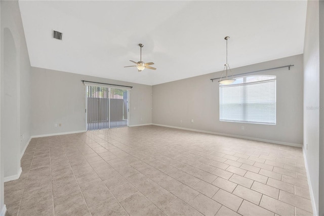 25101 Hyde Park Blvd, Land O Lakes, FL 34639 - spare room featuring lofted ceiling, a ceiling fan, light tile patterned floors, and baseboards