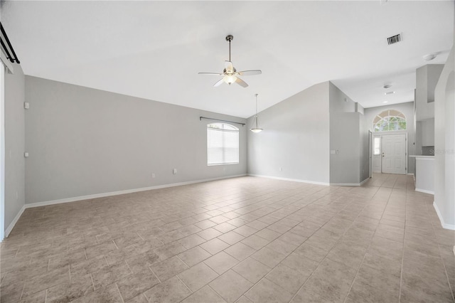 25101 Hyde Park Blvd, Land O Lakes, FL 34639 - unfurnished living room with a ceiling fan, vaulted ceiling, baseboards, and light tile patterned floors