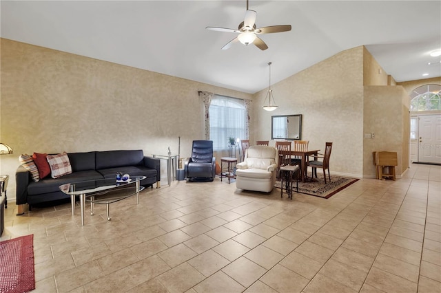 25101 Hyde Park Blvd, Land O Lakes, FL 34639 - living area featuring lofted ceiling, a ceiling fan, healthy amount of natural light, and light tile patterned flooring