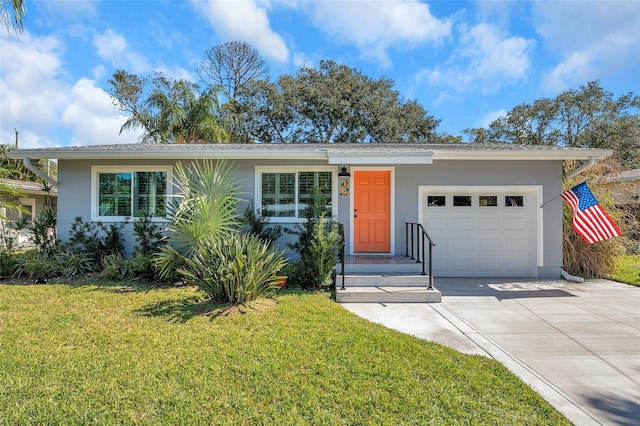 1841 Douglas Ave, Dunedin, FL 34698 - ranch-style house with a garage, driveway, a front yard, and stucco siding