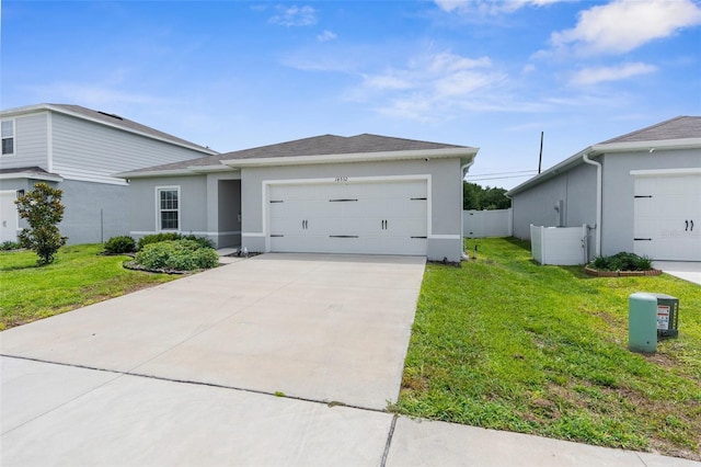 14532 Whitewater Way, Brooksville, FL 34604 - view of front of property featuring stucco siding, a garage, and driveway