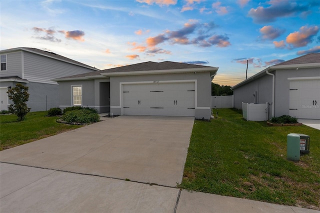 14532 Whitewater Way, Brooksville, FL 34604 - view of front of house featuring stucco siding, a garage, and driveway