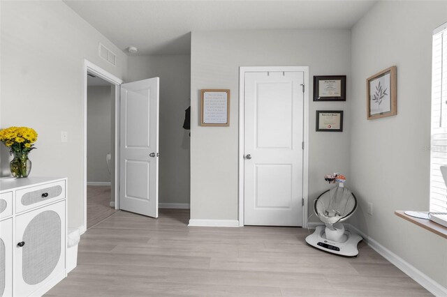 14532 Whitewater Way, Brooksville, FL 34604 - bedroom with light wood-style flooring and baseboards