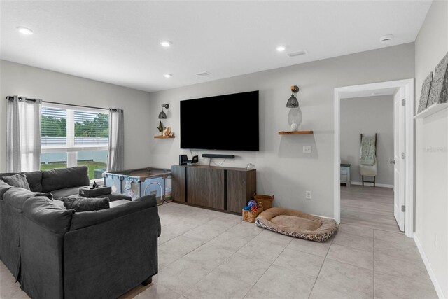 14532 Whitewater Way, Brooksville, FL 34604 - living room featuring light tile patterned floors, recessed lighting, and baseboards