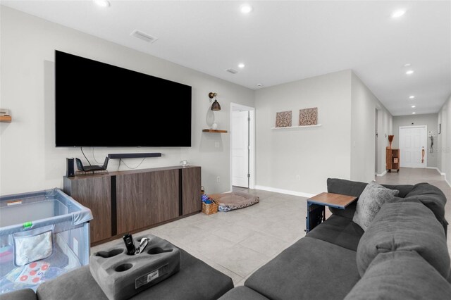 14532 Whitewater Way, Brooksville, FL 34604 - living room featuring recessed lighting, light tile patterned floors, and baseboards