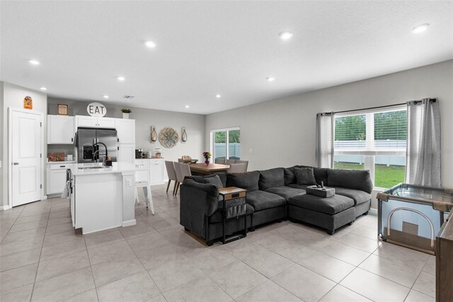 14532 Whitewater Way, Brooksville, FL 34604 - living area with recessed lighting, healthy amount of natural light, and light tile patterned floors