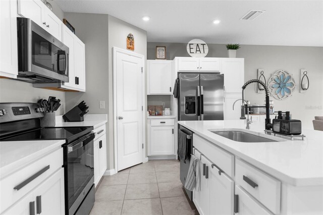 14532 Whitewater Way, Brooksville, FL 34604 - kitchen featuring appliances with stainless steel finishes, a sink, light countertops, white cabinets, and recessed lighting
