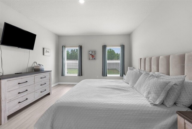 14532 Whitewater Way, Brooksville, FL 34604 - bedroom featuring light wood-style flooring and baseboards