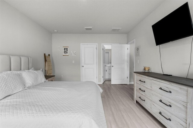 14532 Whitewater Way, Brooksville, FL 34604 - bedroom with light wood-style floors and baseboards