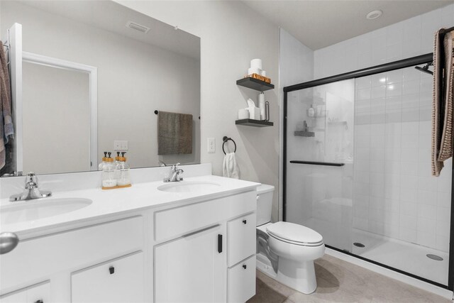 14532 Whitewater Way, Brooksville, FL 34604 - full bathroom with toilet, a stall shower, double vanity, and tile patterned flooring