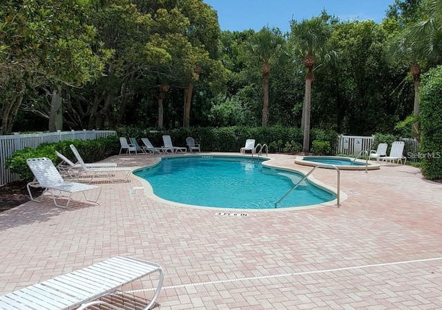 1605 Send Way, Lutz, FL 33549 - community pool with a community hot tub, a patio, and view of scattered trees