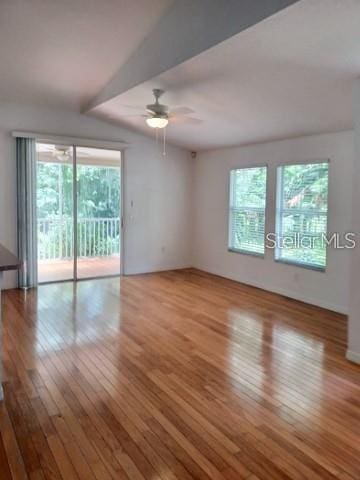 1605 Send Way, Lutz, FL 33549 - unfurnished room with healthy amount of natural light, hardwood / wood-style floors, and a ceiling fan