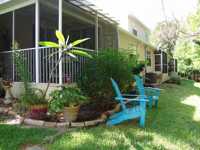1605 Send Way, Lutz, FL 33549 - view of home's exterior featuring a sunroom and a lawn