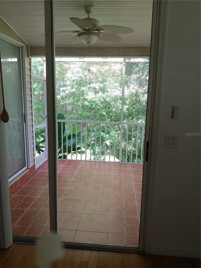 1605 Send Way, Lutz, FL 33549 - doorway with ceiling fan and tile patterned floors