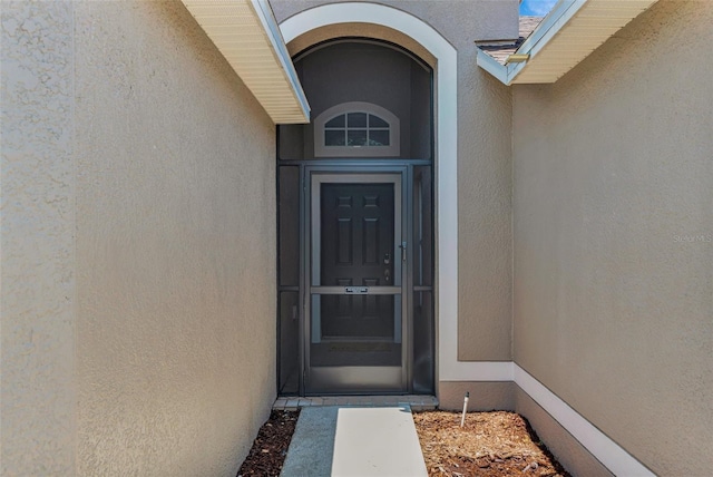 13910 Chalk Hill Pl, Riverview, FL 33579 - doorway to property featuring stucco siding