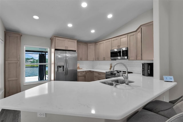 13910 Chalk Hill Pl, Riverview, FL 33579 - kitchen featuring stainless steel appliances, backsplash, a peninsula, light countertops, and recessed lighting