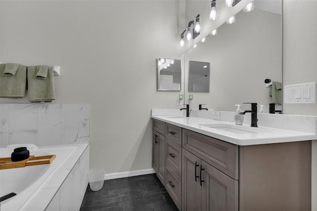 13910 Chalk Hill Pl, Riverview, FL 33579 - full bathroom with double vanity, a bath, and baseboards