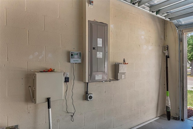13910 Chalk Hill Pl, Riverview, FL 33579 - utility room featuring electric panel and a garage