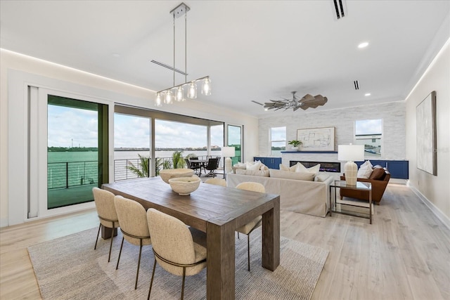 820 Bay Point Dr, Madeira Beach, FL 33708 - dining area with light wood-style flooring and recessed lighting