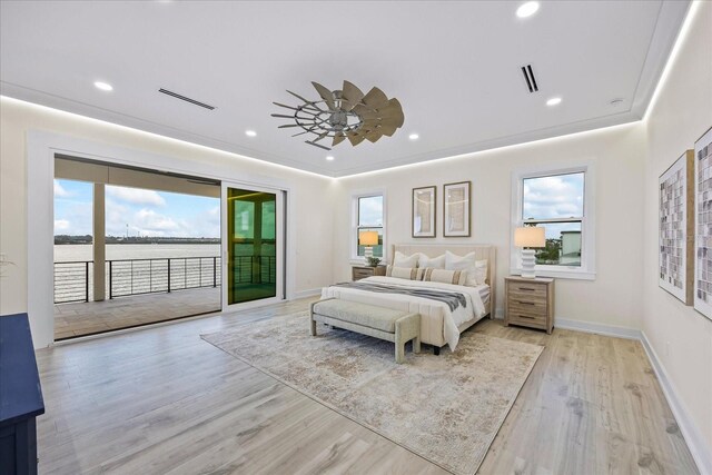 820 Bay Point Dr, Madeira Beach, FL 33708 - bedroom with access to exterior, wood finished floors, recessed lighting, baseboards, and a water view