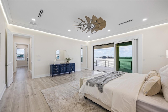 820 Bay Point Dr, Madeira Beach, FL 33708 - bedroom with access to exterior, multiple windows, light wood-style flooring, recessed lighting, and baseboards