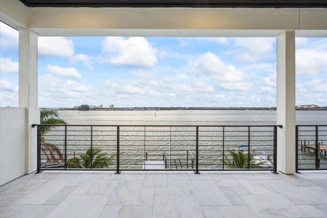 820 Bay Point Dr, Madeira Beach, FL 33708 - view of patio with a water view and a balcony