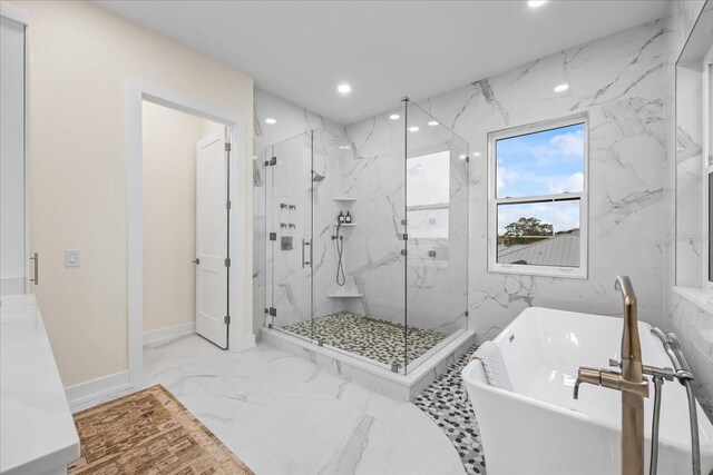 820 Bay Point Dr, Madeira Beach, FL 33708 - full bathroom featuring recessed lighting, a marble finish shower, a freestanding bath, marble finish floors, and baseboards