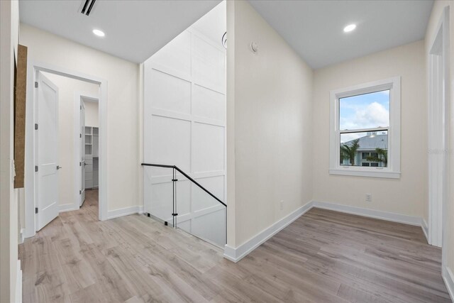 820 Bay Point Dr, Madeira Beach, FL 33708 - hallway featuring light wood-style floors, baseboards, and recessed lighting