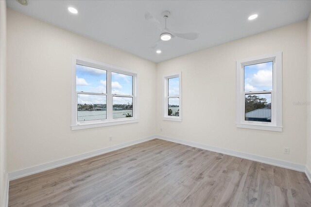 820 Bay Point Dr, Madeira Beach, FL 33708 - empty room with light wood-type flooring, a ceiling fan, baseboards, and recessed lighting