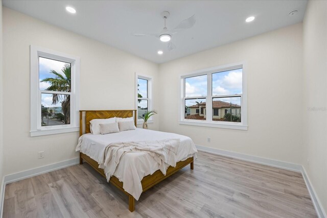 820 Bay Point Dr, Madeira Beach, FL 33708 - bedroom with light wood-style floors, baseboards, a ceiling fan, and recessed lighting