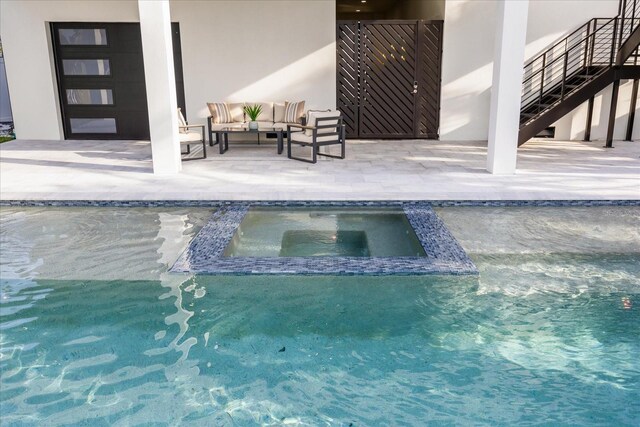 820 Bay Point Dr, Madeira Beach, FL 33708 - view of swimming pool featuring outdoor lounge area, a patio, and a pool with connected hot tub