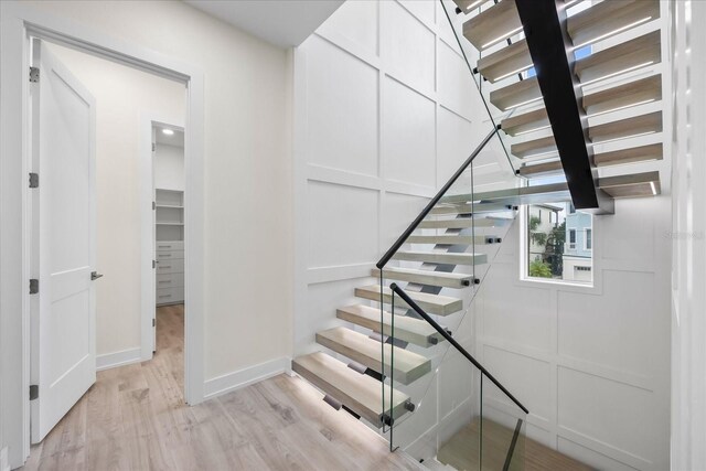 820 Bay Point Dr, Madeira Beach, FL 33708 - staircase featuring wood finished floors and baseboards