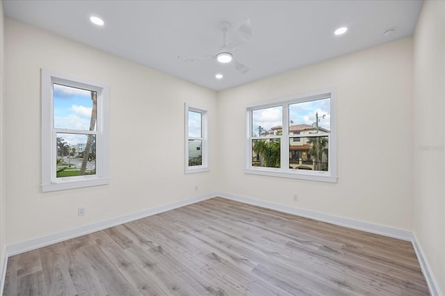 820 Bay Point Dr, Madeira Beach, FL 33708 - spare room featuring a ceiling fan, light wood-type flooring, baseboards, and recessed lighting
