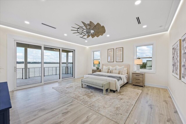 820 Bay Point Dr, Madeira Beach, FL 33708 - bedroom with access to exterior, a water view, light wood-style flooring, recessed lighting, and baseboards