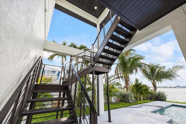 820 Bay Point Dr, Madeira Beach, FL 33708 - staircase featuring a water view