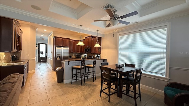 7810 Whitemarsh Way, Reunion, FL 34747 - dining space featuring light tile patterned floors, a ceiling fan, ornamental molding, and baseboards