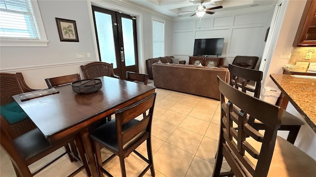 7810 Whitemarsh Way, Reunion, FL 34747 - dining area featuring french doors, light tile patterned flooring, ceiling fan, coffered ceiling, and beam ceiling