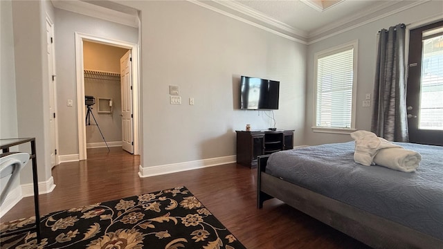 7810 Whitemarsh Way, Reunion, FL 34747 - bedroom with dark wood-type flooring, baseboards, crown molding, and a spacious closet