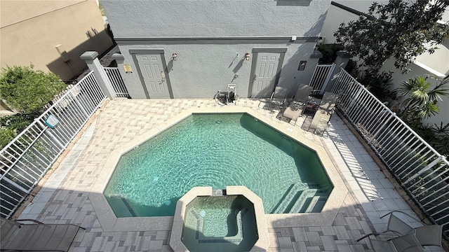 7810 Whitemarsh Way, Reunion, FL 34747 - view of swimming pool with a pool with connected hot tub and a patio area