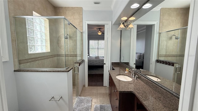 7810 Whitemarsh Way, Reunion, FL 34747 - full bath featuring vanity, tile patterned flooring, a shower stall, crown molding, and ensuite bath
